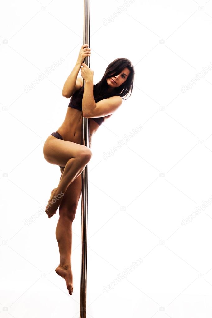 Beautiful young woman exercise pole dance