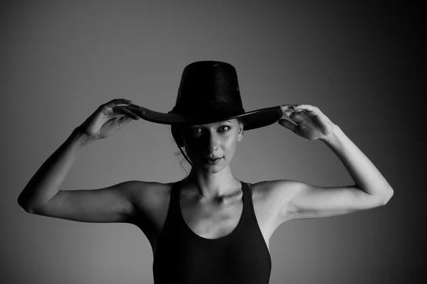 Beautiful woman in a hat and a shirt — Stock Photo, Image