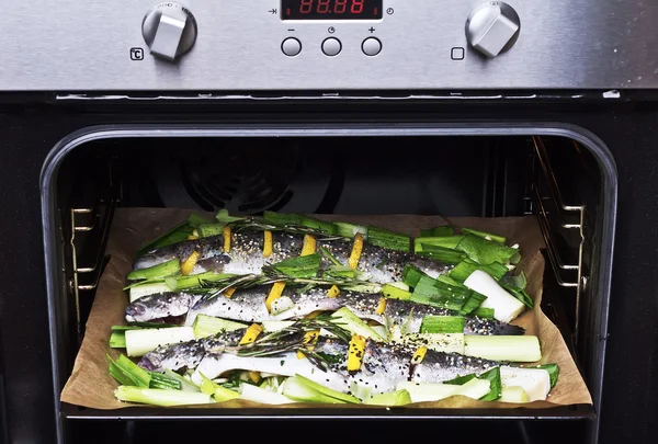 Cooking trout fish with lemon.