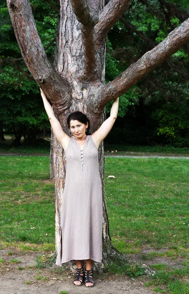 Woman near a tree in the park