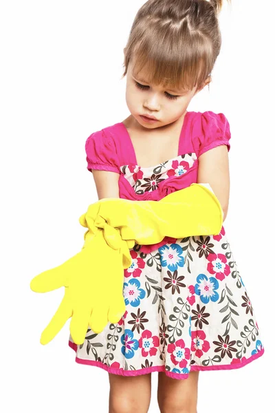 Niña con guantes de goma en el fondo blanco Imágenes de stock libres de derechos