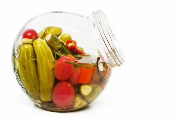 Pickled cucumbers in a glass jar — Stock Photo, Image
