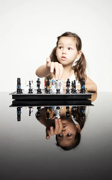 Little girl playing chess — Stock Photo, Image