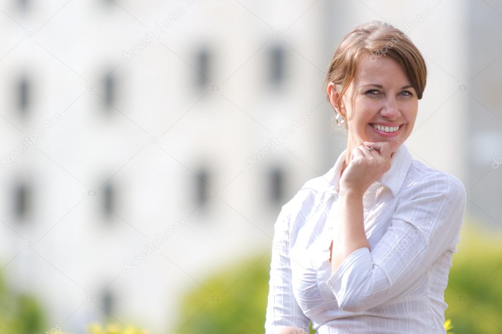 Portrait of a young attractive woman in the city