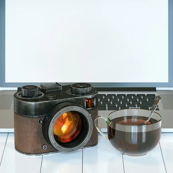 Vintage camera and laptop and glass cup of hot tea on white hard — Stock Photo, Image