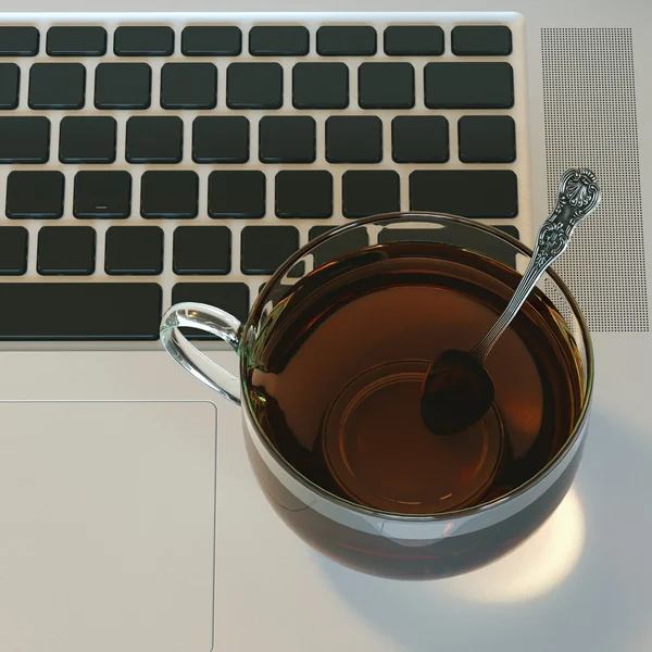 Glass cup of hot tea on laptop on white hardwood table. Top view — Stock Image Glass cup of hot tea on laptop on white hardwood table. Top view Stock Picture