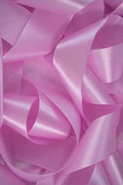 Zarif pembe kurdele arka planı. Saten kumaş dokusu. Neşeli arkaplan