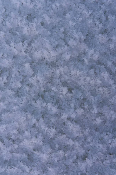 Ιστορικό, υφή φρέσκου χιονιού. Κοντινές νιφάδες χιονιού. Η χειμερινή ώρα του έτους — Φωτογραφία Αρχείου