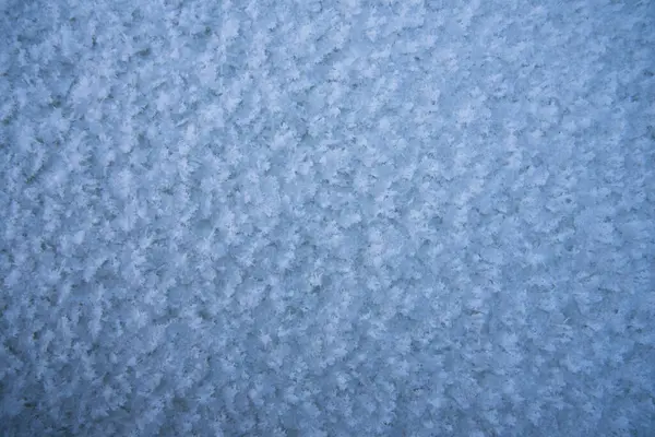 背景，新下的雪的质地。雪片的特写。一年中的冬季 — 图库照片