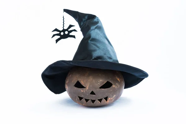 A pumpkin made from clay. Pumpkin for Halloween, the pumpkin is wearing a witch hat. Attributes for the holiday on a white background Stock Image