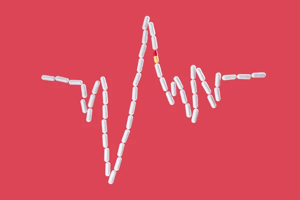 Cardiogram from medical capsules on a red background. Concept of vitamins and medicines for the heart, cardiology, dietary supplements.