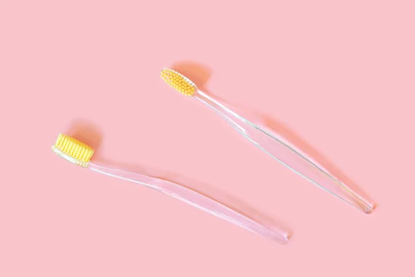 Toothbrushes Yellow Bristles Pink Background Oral Hygiene Dentistry Teeth Cleaning — Stock Photo, Image