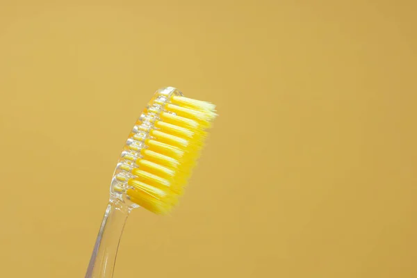 Toothbrush Yellow Bristles Yellow Background Close Oral Hygiene Dentistry Teeth — Stock Photo, Image