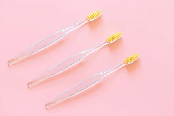 Toothbrushes Yellow Bristles Pink Background Oral Hygiene Dentistry Teeth Cleaning — Stock Photo, Image