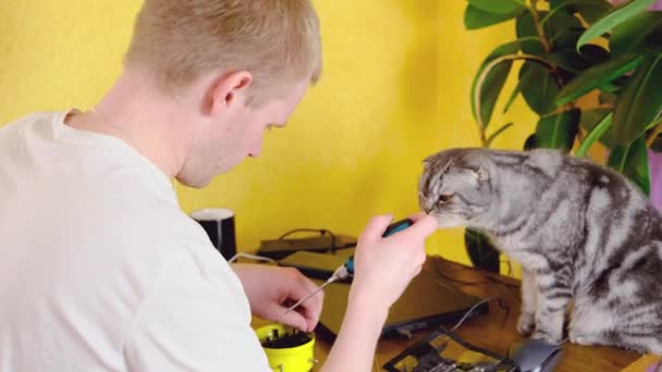 Blond Man Sits Table Screwdriver His Hands Fixes His Watch — Stock Video