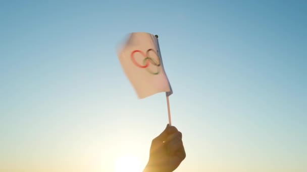 Olympic Flag Small Hand Flutters Backdrop Blue Sky Setting Sun — Stock Video