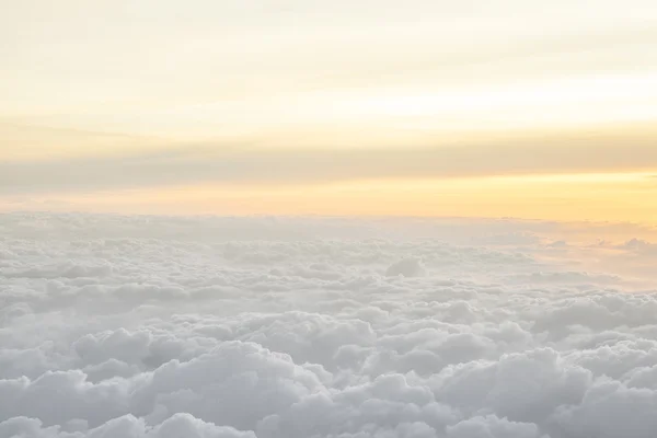 High above the clouds with beautiful sunset light