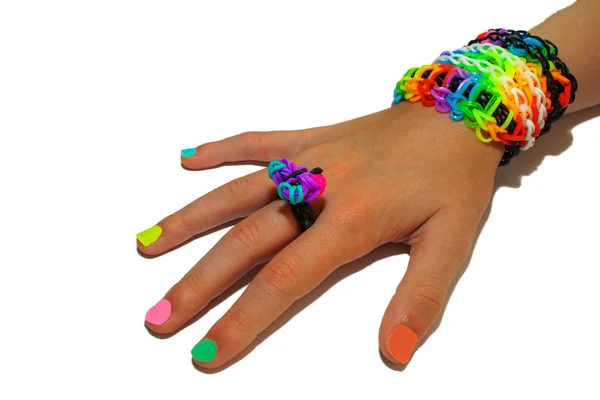 Child's hand decorated with rubber bands loom — Stock Photo, Image