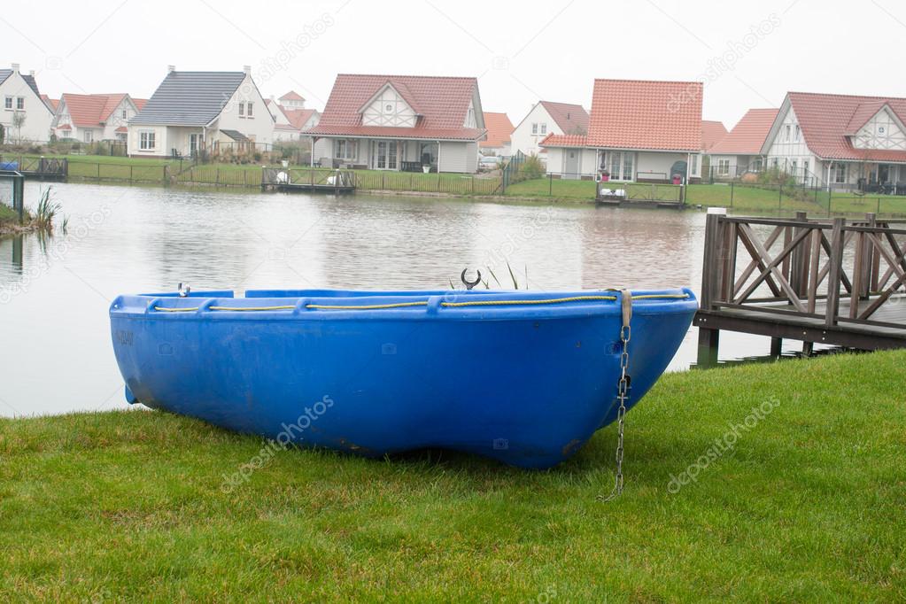 Blue rowboat on the lake on vacation.