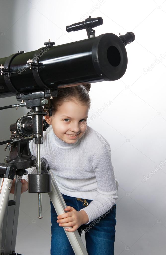 Child Looking Into Telescope Star Gazing Little girl isolated on a white background