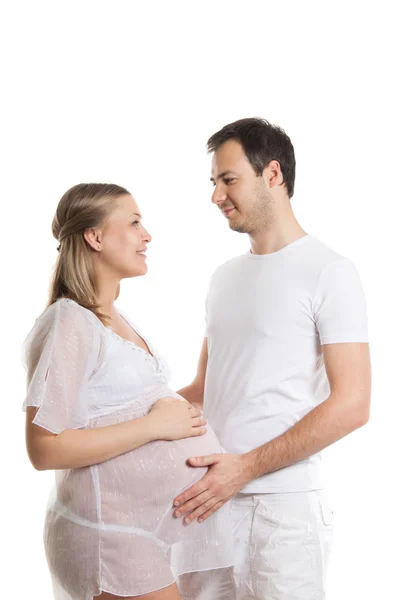 Portrait of happy couple waiting for a baby. Attractive man and woman on a white background. Pregnancy, family, childbirth — Stock Photo, Image