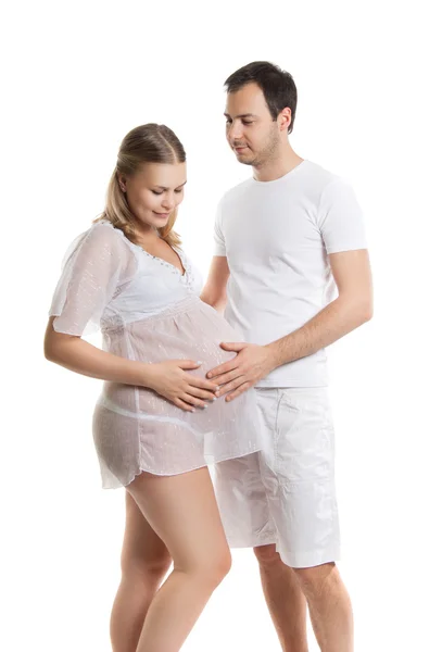 Portré a boldog pár vár egy babát. Vonzó férfi és a nő egy fehér háttér. Terhesség, családi, szülés — Stock Fotó