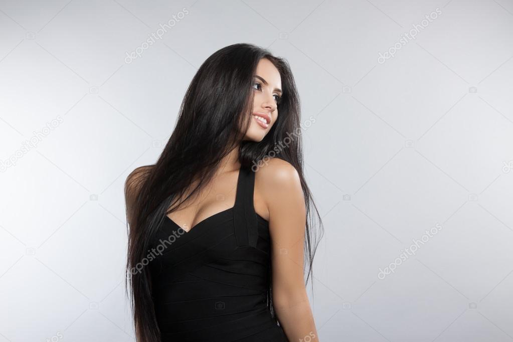 Beautiful model girl with smooth dark hair.