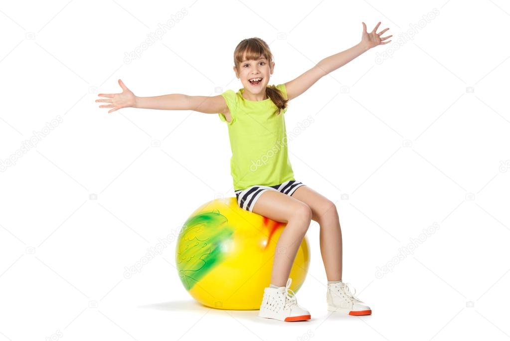 young girl doing gymnastics with ball