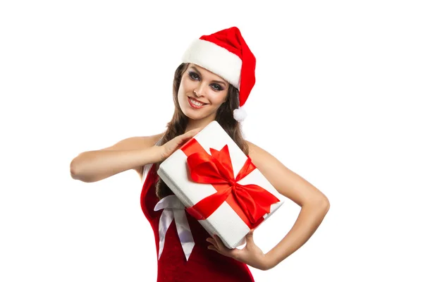 Pretty girl in santa hat with Christmas present — Stock Photo, Image