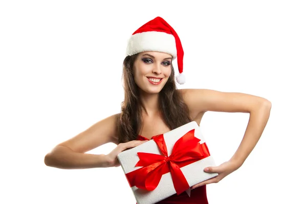 Pretty girl in santa hat with Christmas present — Stock Photo, Image