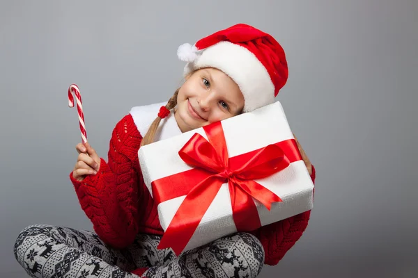 Happy girl with Christmas present — Stock Photo, Image