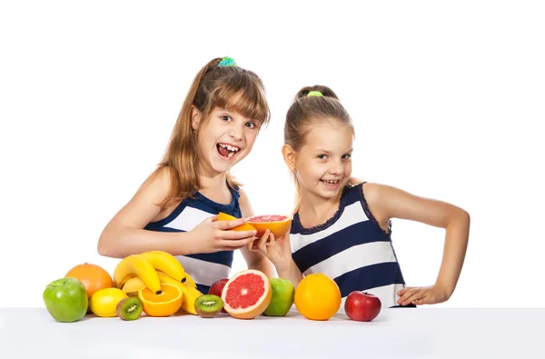 Girl with citrus on a white background — Stock Photo, Image