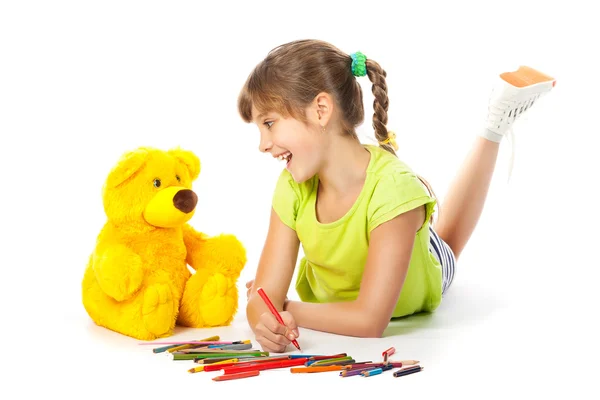 Cheerful girl draws pencil — Stock Photo, Image