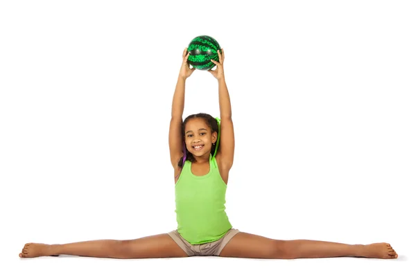 Chica se dedica a la gimnasia. niño sentado en las divisiones. aislado sobre un fondo blanco —  Fotos de Stock