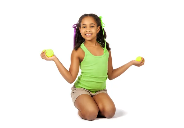 Menina com bolas de tênis — Fotografia de Stock