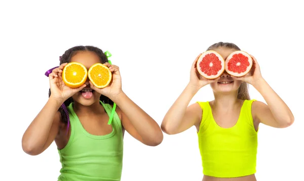 Joyful girl with citrus on a white background — Stock Photo, Image