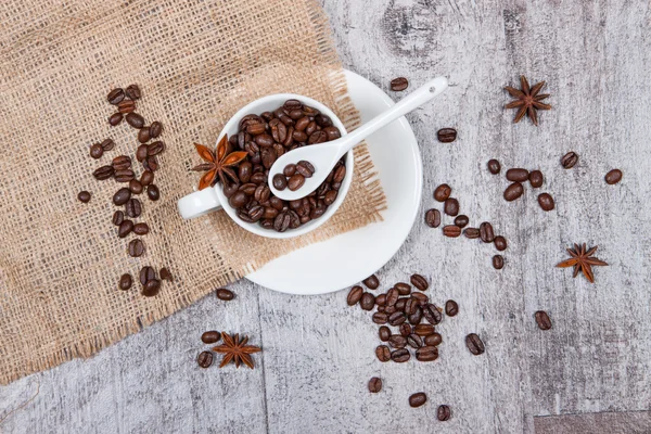 Cup with coffee beans — Stock Photo, Image