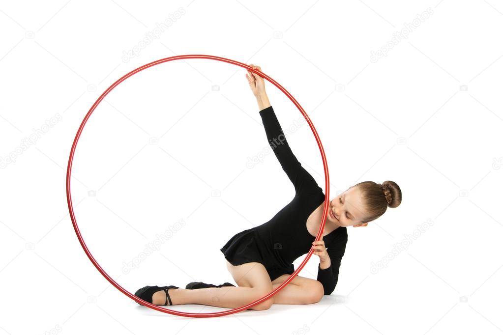 Happy girl gymnast with a hoop