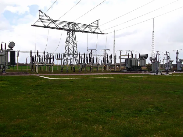 Substation with transformer and overhead line mast