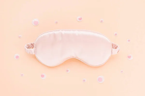 Sleeping mask and googly eyes, insomnia concept