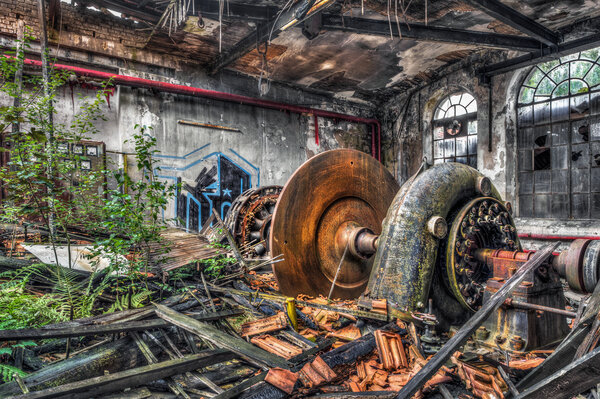 Old turbine in a ruined factory