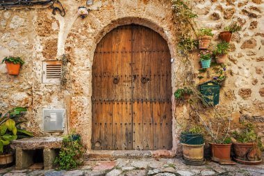 Doorway of traditional stone finca house in Valldemossa clipart