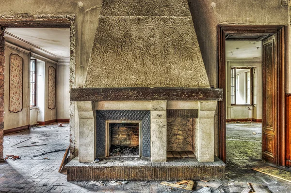 Fireplace in an abandoned manor — Stock Photo, Image