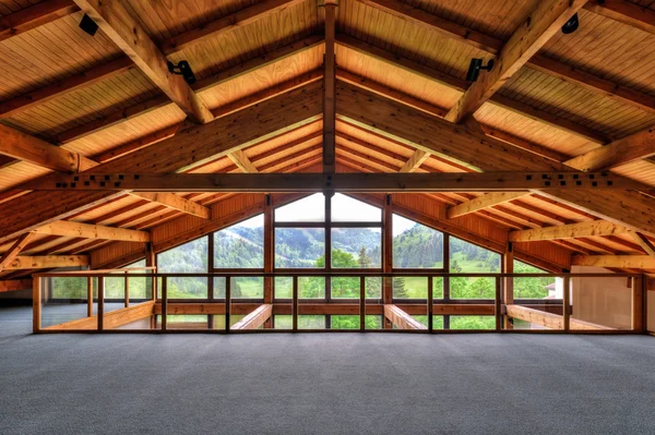 Alpine chalet window looking out into mountains — Stock Photo, Image