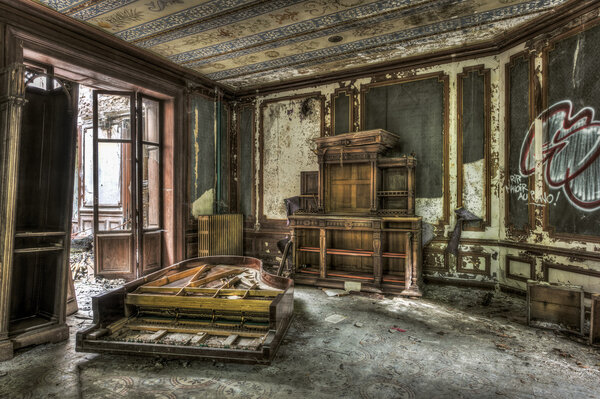 Broken and vandalized piano in an abandoned manor.tif