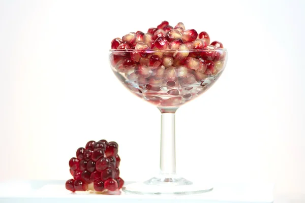 Fresh healthy tropical pomegranate in glass — Stock Photo, Image