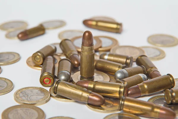 Ammunition and valid coins. — Stock Photo, Image