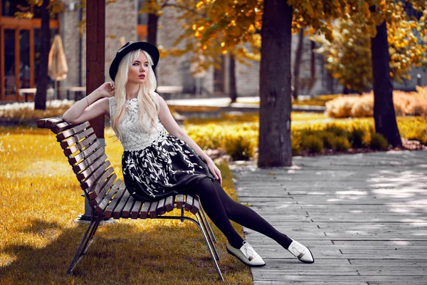 Lovely girl in posing outdoors Stock Picture