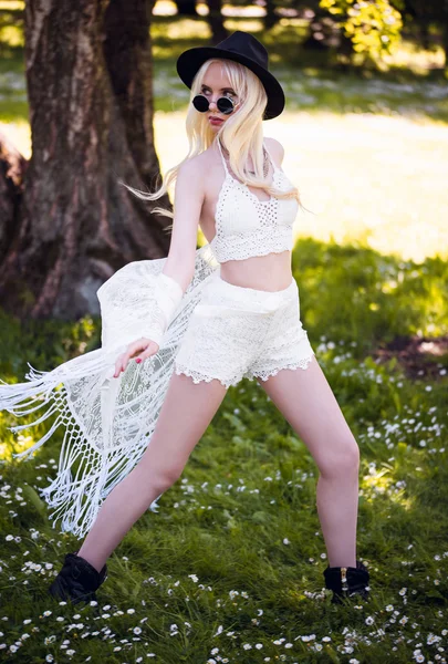 Cute blonde young girl in posing outdoors — Stock Photo, Image