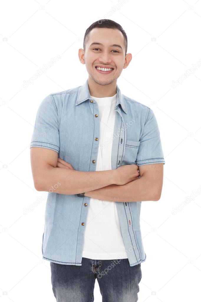 man smiling with arms crossed